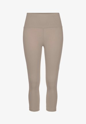 Beige, high-waisted leggings made of stretchy fabric, featuring a smooth texture and a fitted design that tapers at the ankles.