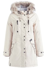 Parka d'hiver couleur crème avec une capuche bordée de fourrure, des boutons-pression noirs, deux poches poitrine verticales zippées et des poches latérales à rabat.