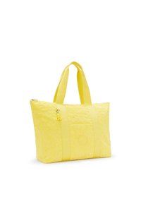 Gul tote taske med blomstermønster, robust stof, dobbelte håndtag og lynlåslukning. Har en dekorativ charm på siden.