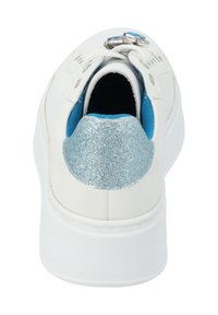 White sneaker with a rounded toe, blue interior lining, and a silver glitter heel accent. Features white laces and eyelet details.