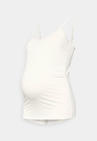 Top bianco per gravidanza con spalline regolabili, pizzo lungo il collo e una silhouette aderente che si adatta a una pancia in crescita.