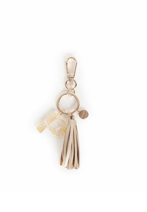 Portachiavi con un gancio in oro, ciondolo in plastica trasparente con glitter e un tassello in ecopelle beige. Presenta un accento in metallo circolare.