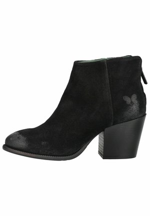 Black suede ankle boot with a rounded toe, chunky block heel, and zipper at the back.