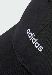 Black adjustable cap made of cotton with a structured design. Features white embroidered "adidas" logo on the front.