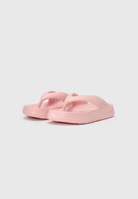 Rosa flip-flops laget av gummi med en jevn tekstur, med en Y-formet stropp og en flat, polstret såle.