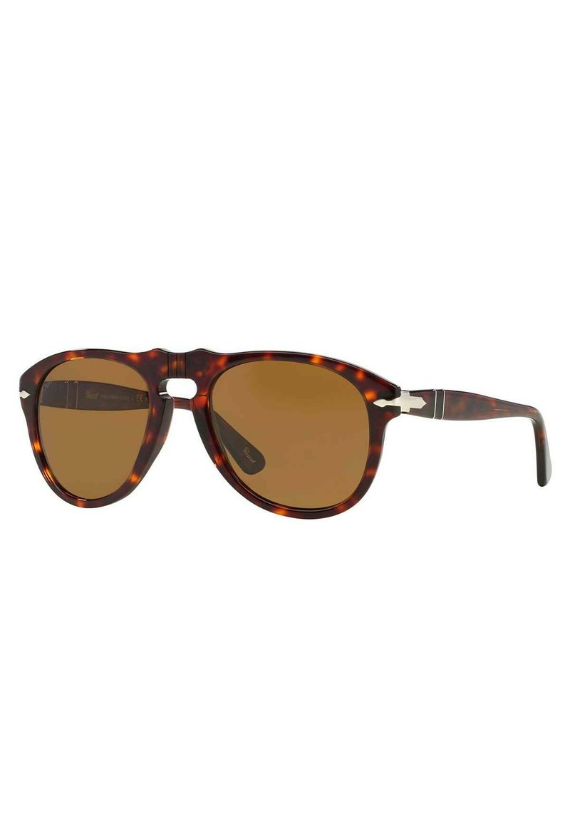 Gafas de sol con estampado carey y lentes marrones; una forma de ojo de gato y detalles metálicos en las patas; presenta un diseño de puente en forma de llave.