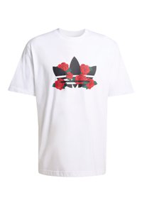 Biele bavlnené tričko s potlačou čiernych a červených ruží so zelenými listami, ktoré sú umiestnené v strede nad tromi čiernymi pruhmi. Voľný strih.