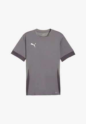 Graues Puma-Sportshirt mit kurzen Ärmeln, dunkleren seitlichen Einsätzen und Ärmelbündchen, mit weißem Puma-Logo auf der rechten Brust.