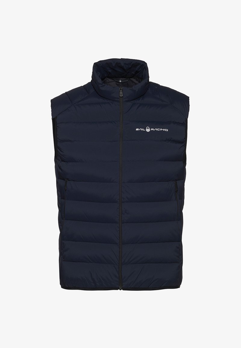 Marineblauwe gewatteerde vest met hoge kraag, rits aan de voorkant en gestikte panelen. Bevat een logo op de borst en zijzakken voor opslag.