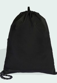 Black drawstring backpack made from textured fabric, features a smooth base and thick, patterned rope handles for secure closure.