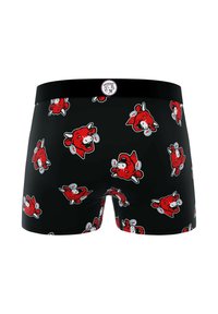 Boxer shorts noirs avec un motif répété de têtes de vache en cartoon rouges avec des accents blancs. La ceinture est noire avec une étiquette de logo.