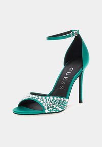 Guess SANDALETTE KABLE SCHMUCKAPPLIKATIONEN - Sandali con tacco - grün