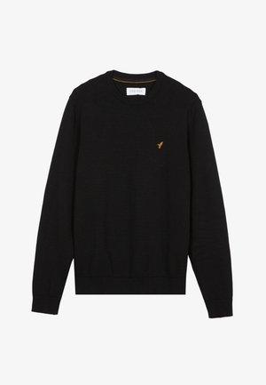 Black sweater made of soft material, featuring long sleeves, a round neckline, and a small golden bird logo on the left chest.