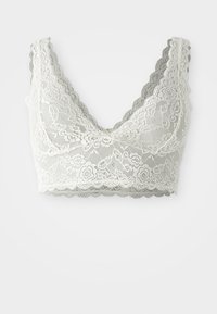 Bralette in pizzo in crema e grigio. Bordo ondulato, motivo floreale, design a scollo a v, tessuto trasparente con una consistenza morbida, coppe non foderate.