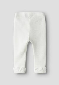 Witte gebreide legging met een gestructureerd ontwerp met horizontale strepen en kantaccenten bij de pijpen. Elastische tailleband voor comfort.