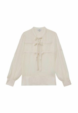 Bluza de culoare crem, cu textură cu dungi subțiri, mâneci lungi bufante, guler rotund și detaliu cu fundă în față. Are două buzunare la piept.