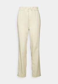 Lichtbeige broek met een elastische tailleband en verstelbaar trekkoord. Rechtestrijk ontwerp met een zachte textuur en geen zichtbare patronen.