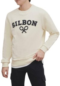 Sudadera crema con lettering en navy "SILBON" y motivo de tijeras. Cuenta con puños y bajo de canalé, corte relajado y textura suave.