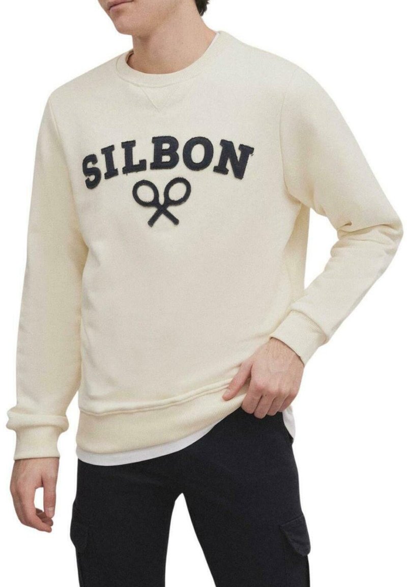 Sudadera crema con lettering en navy "SILBON" y motivo de tijeras. Cuenta con puños y bajo de canalé, corte relajado y textura suave.
