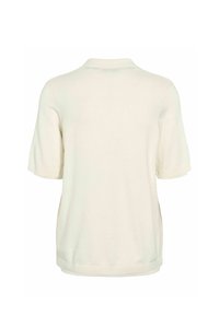 Haut en maille à manches courtes blanc cassé avec un col, présenté de dos sur un fond blanc.