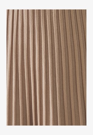 Pleated fabric in a soft beige color, featuring vertical stripes that create a textured surface. Material appears lightweight and smooth.