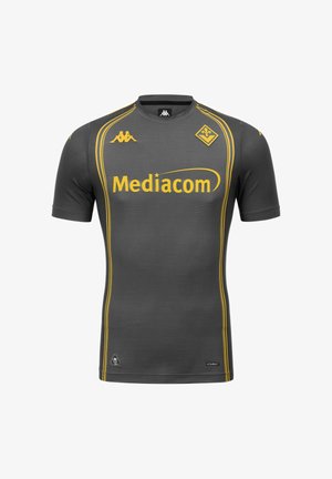 Maillot de football gris foncé avec des rayures jaunes, logo Mediacom, logo de la marque Kappa et un emblème d'équipe jaune en forme de diamant sur la poitrine.