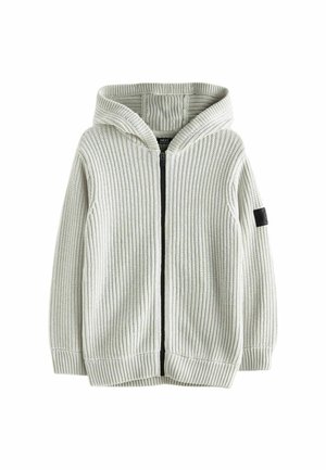 Sweat à capuche zippé gris clair en maille avec texture côtelée et patch noir sur la manche gauche.