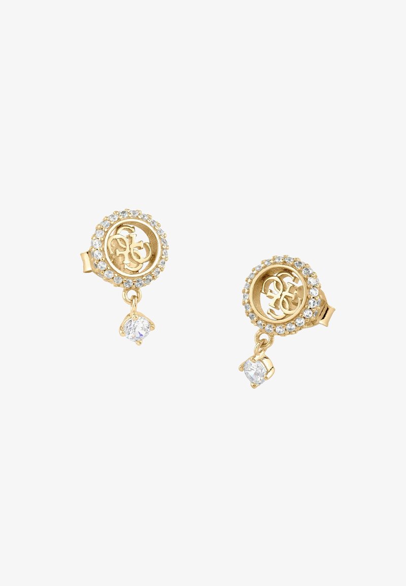 Boucles d'oreilles clous en or avec un logo circulaire au centre, entouré de petites pierres claires, chacune avec une pierre précieuse claire pendante.