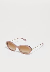 Rosa ovale solbriller med gradient brune linser, metallakenter og slanke armer. Rammen har en blank finish.