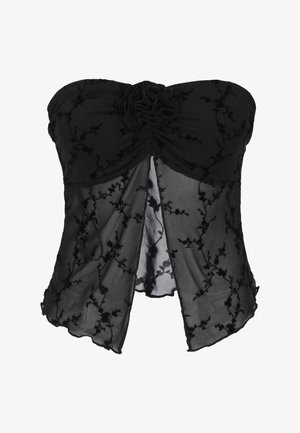 Zwart strapless top met doorschijnende bloemenkant, gerimpeld in het midden en een stoffen bloemdetail op de buste.