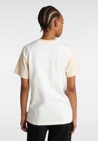 Cotton t-shirt with a crew neck; white and beige color block design. Features short sleeves and a straight hem with a side label.