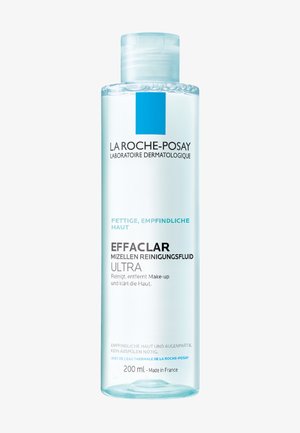 Clear liquid cleanser in a transparent plastic bottle. Blue accent on the label with black text. Size: 200 mL, French origin.
