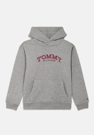 Light grey hoodie with front pocket, maroon "TOMMY HILFIGER" text across chest, and small logo on left sleeve cuff.