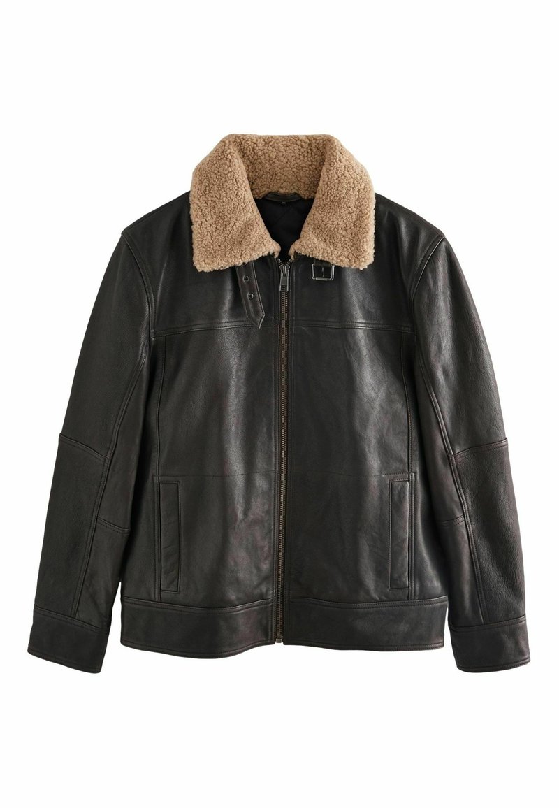 Black leather jacket with a tan shearling collar, zip front, side pockets, and a smooth finish. Designed with a classic, structured silhouette.