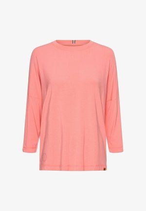 Rosa Langarmoberteil mit rundem Ausschnitt, lockerer Passform und weichem Material. Enthält ein kleines Logo-Detail nahe dem Saum.