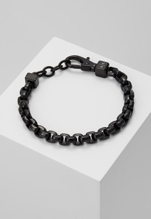 Black chain bracelet made of shiny metal links, featuring square accents and a clasp. Smooth surface with a minimalist design.