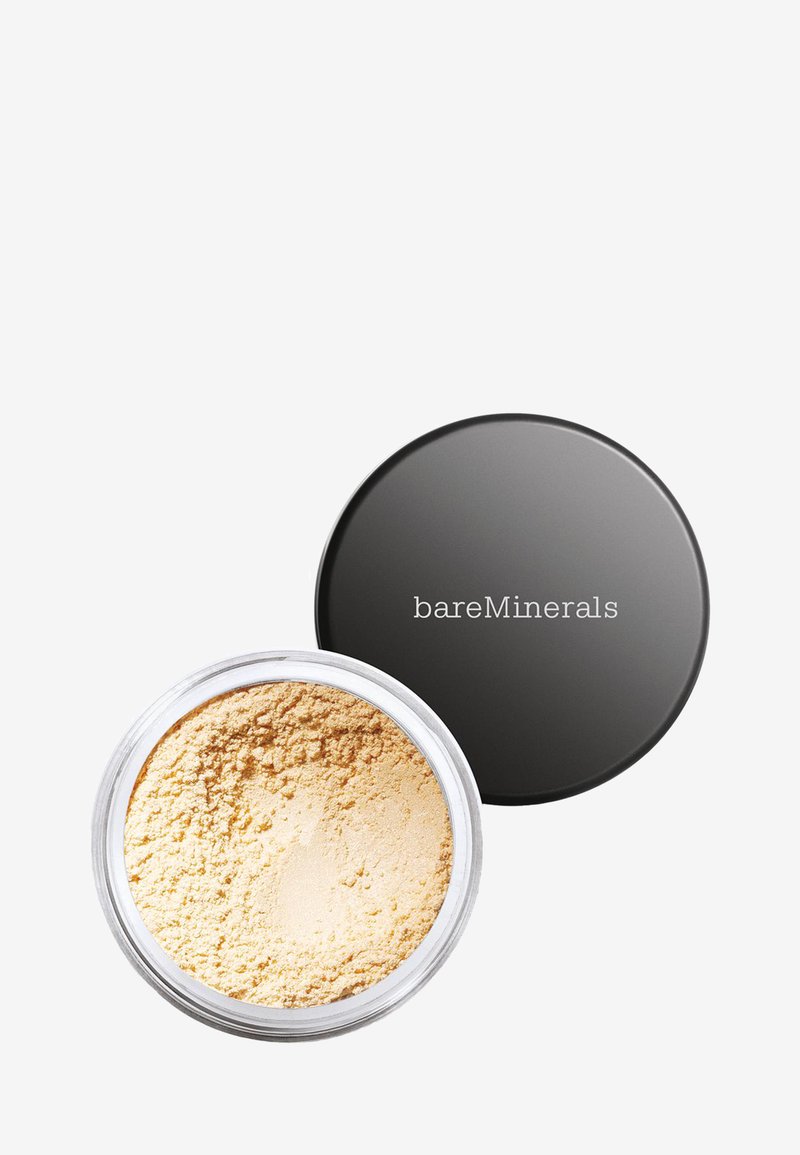 Poudre libre minérale beige pour le visage dans un contenant rond transparent avec un couvercle noir étiqueté bareMinerals, présenté ouvert sur fond blanc.