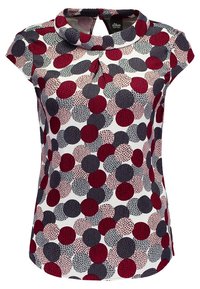 Blusa de manga corta con cuello alto, frente plisado y patrón de grandes lunares multicolores en rojo, rosa, gris y negro.