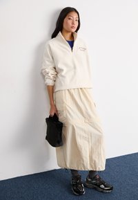 New Balance GRAPHIC POLAR HALF ZIP - Sweat polaire - beige