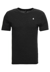 Černé bavlněné tričko s krátkým rukávem, kulatým výstřihem a malým bílým logem na hrudi, s hladkou strukturou a klasickým střihem.