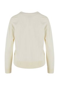 Pull crème, texture tricotée, encolure ronde, manches longues, ourlet et poignets côtelés, design simple et épuré.