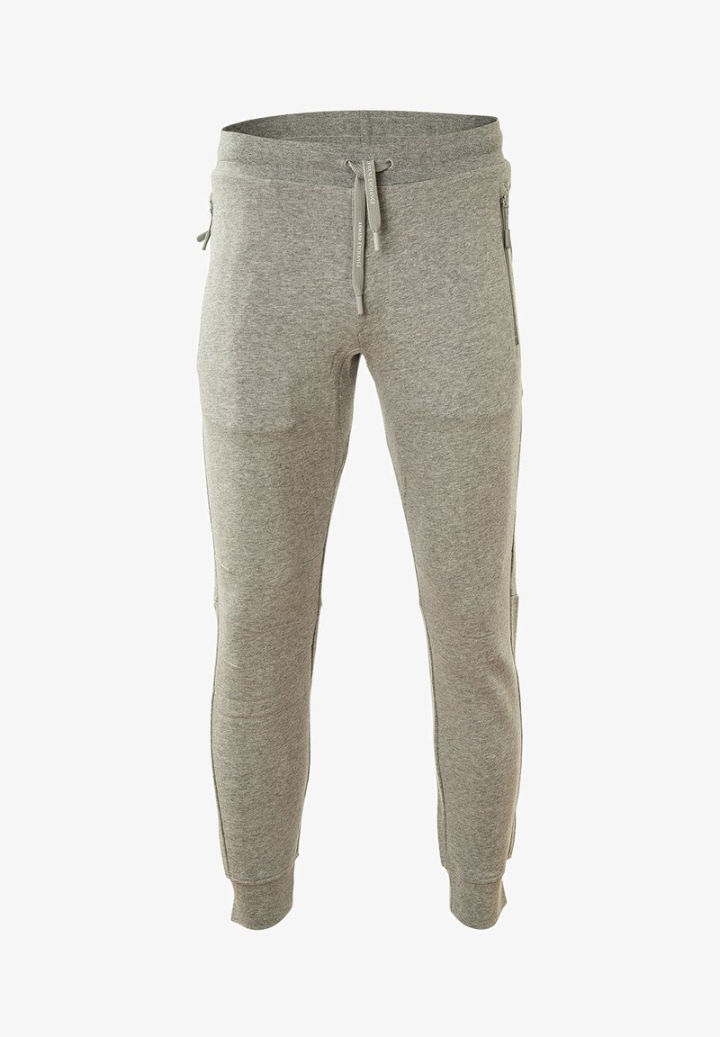 Graue Sweatpants mit einem taillierten Bein-Design, hergestellt aus weichem Baumwollmaterial. Mit Kordelzugbund und seitlichen Reißverschlusstaschen.
