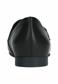 Black leather flats with a low heel, featuring a smooth texture, rounded back, and minimal stitching detail.