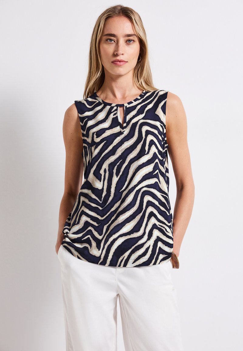 Navy sleeveless top with white zebra stripes, featuring a keyhole neckline detail. Made from lightweight fabric with a relaxed fit.