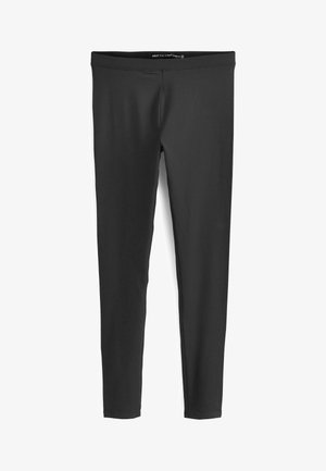 Leggings negros de cuerpo entero, confeccionados en un material elástico, con una textura suave y un diseño de cintura sin costuras y sencillo.