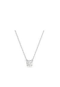 Sudraba ķēde ar apaļu, caurspīdīgu kristāla piekariņu centrā. Ķēde ir savienota un tai ir smalka tekstūra.