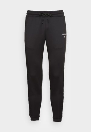 RUNNER TRACK PANTS - Pantalones deportivos - black