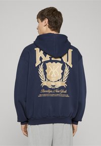 Karl Kani SCRIPT EMBLEM HOODIE - Športna jopa s kapuco na zadrgo - dark blue