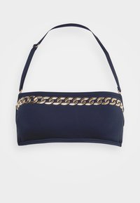 Top de bikini azul marinho feito de um tecido suave, apresentando um detalhe em corrente metálica dourada na frente e alças ajustáveis.