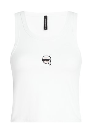 Witte geribbelde tanktop met een strakke pasvorm. Bevat een kleine, geborduurde afbeelding van een gestileerd gezicht met zonnebril op de borst.